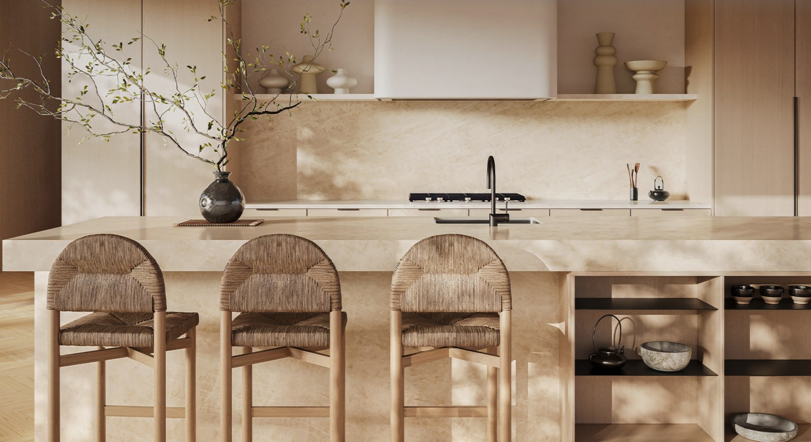 Warm, light kitchen with a stone island and splashback