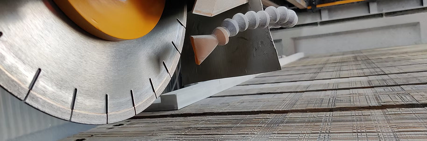 Close-up of a diamond saw blade and water jet