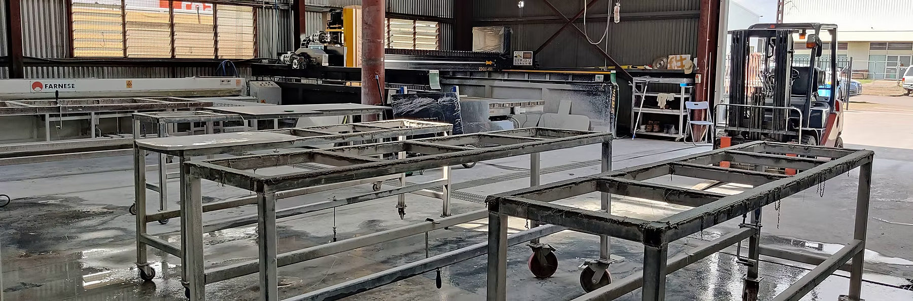 Fabrication tables and edge machines on the workshop floor